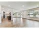 Open concept living room with a hardwood floor that seamlessly blends indoor and outdoor living at 713 W West St, Tampa, FL 33603
