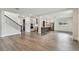 Spacious open-concept living area with hardwood floors connecting to a modern kitchen at 713 W West St, Tampa, FL 33603