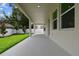Spacious covered patio overlooks the yard and provides ample outdoor living and entertaining space at 713 W West St, Tampa, FL 33603