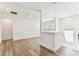 Open upstairs area with hardwood floors and lots of natural light at 713 W West St, Tampa, FL 33603