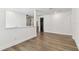 Upstairs area with hardwood floors leading to a bathroom at 713 W West St, Tampa, FL 33603