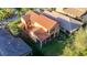 Aerial view of the house and the green backyard with mature landscaping at 8264 Dunham Station Dr, Tampa, FL 33647
