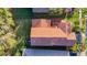Aerial shot of the house showcasing the beautiful tiled roof and mature landscaping at 8264 Dunham Station Dr, Tampa, FL 33647