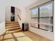 Bedroom with stairs leading to a room with a large window; natural light bathes the interior at 8264 Dunham Station Dr, Tampa, FL 33647