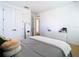 Spacious bedroom with double door closet, white dresser and minimalist décor at 8264 Dunham Station Dr, Tampa, FL 33647