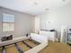 Bedroom featuring neutral walls and carpet, a bright window and a minimalist bed frame at 8264 Dunham Station Dr, Tampa, FL 33647