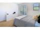 Well-lit bedroom with carpet, a large window, and ample storage space with a dresser at 8264 Dunham Station Dr, Tampa, FL 33647