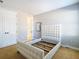 Bedroom with double doors, a comfortable carpet, and a stylish white bed frame at 8264 Dunham Station Dr, Tampa, FL 33647