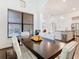 Open-concept dining room with views of the kitchen and living areas, creating an inviting atmosphere at 8264 Dunham Station Dr, Tampa, FL 33647