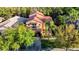 Exterior aerial view of the home with lush landscaping in a beautiful neighborhood at 8264 Dunham Station Dr, Tampa, FL 33647