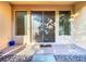 Elegant double front doors flanked by sidelight windows and an entryway featuring a stone-tiled front porch at 8264 Dunham Station Dr, Tampa, FL 33647