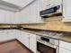Kitchen features stainless steel oven, granite countertops, and built-in microwave at 8264 Dunham Station Dr, Tampa, FL 33647