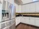 Kitchen features a stainless steel refrigerator and granite countertops at 8264 Dunham Station Dr, Tampa, FL 33647