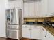Kitchen with stainless steel refrigerator and granite countertops at 8264 Dunham Station Dr, Tampa, FL 33647