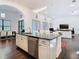 Kitchen island with stainless steel dishwasher and seating at 8264 Dunham Station Dr, Tampa, FL 33647