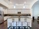 Kitchen featuring a large island with seating and modern lighting at 8264 Dunham Station Dr, Tampa, FL 33647