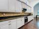 Kitchen features stainless steel oven, granite countertops, and tile backsplash at 8264 Dunham Station Dr, Tampa, FL 33647
