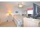 Bedroom featuring light color walls, carpet, a ceiling fan, and a large window at 960 Virginia St # 205, Dunedin, FL 34698