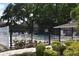 A gated community pool with a 'no smoking' sign and pool rules posted for guests at 960 Virginia St # 205, Dunedin, FL 34698