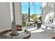 Inviting outdoor patio area with grilling station and serene view of the pond at 960 Virginia St # 205, Dunedin, FL 34698