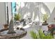 Outdoor patio space with picnic table, grill and mature trees at 960 Virginia St # 205, Dunedin, FL 34698