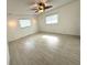 Spacious bedroom with tile floors, ceiling fan and abundant natural light from two windows at 10063 40Th N St # 3, Pinellas Park, FL 33782