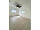 Well-lit bedroom with tiled floors, ceiling fan and windows at 10063 40Th N St # 3, Pinellas Park, FL 33782