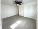 Bright bedroom with tile floors, ceiling fan, and closet at 10063 40Th N St # 3, Pinellas Park, FL 33782