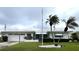 Charming single-story home with a well-manicured front yard and a two-car garage at 10063 40Th N St # 3, Pinellas Park, FL 33782
