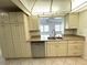 Kitchen featuring stainless steel appliances, tiled floors, and white cabinets at 10063 40Th N St # 3, Pinellas Park, FL 33782