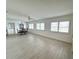 Bright living room with tile floors, ceiling fan, and a dining area with a view at 10063 40Th N St # 3, Pinellas Park, FL 33782