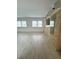 Open living room area with large windows and display cabinets at 10063 40Th N St # 3, Pinellas Park, FL 33782