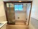 Close-up of a bathtub-shower combo, featuring a showerhead and tiled walls at 10063 40Th N St # 3, Pinellas Park, FL 33782