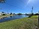 Beautiful water view of the lake surrounded by green lawns and well-maintained landscaping at 10063 40Th N St # 3, Pinellas Park, FL 33782
