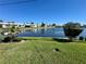 Picturesque water view of community lake surrounded by green lawns and landscaping at 10063 40Th N St # 3, Pinellas Park, FL 33782