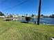Scenic water view of lake lined with lush green lawns and manicured landscaping at 10063 40Th N St # 3, Pinellas Park, FL 33782
