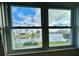 Charming view from a window, overlooking a tranquil canal and lush landscaping at 10063 40Th N St # 3, Pinellas Park, FL 33782
