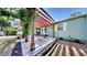Outdoor patio featuring covered pergola, lush plantings, and lawn at 1011 W Charter St, Tampa, FL 33602