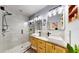 Bright bathroom with a glass shower, double sink vanity, and modern lighting at 1011 W Charter St, Tampa, FL 33602