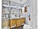 Bright bathroom featuring a double vanity, modern lighting, and a glass-enclosed shower at 1011 W Charter St, Tampa, FL 33602