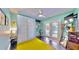 Comfortable bedroom with a ceiling fan, a Murphy bed, and access to the backyard through French doors at 1011 W Charter St, Tampa, FL 33602