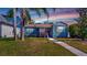 Charming home with a freshly manicured lawn, quaint front porch, and delightful curb appeal at 1011 W Charter St, Tampa, FL 33602