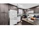 Modern kitchen featuring granite countertops, updated appliances, and ample cabinet space at 1011 W Charter St, Tampa, FL 33602