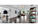 Open-concept living room view showcases a fluid layout, connecting seamlessly to other living spaces at 1011 W Charter St, Tampa, FL 33602