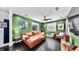 A spacious living room with a comfortable leather sofa and plenty of natural light at 1011 W Charter St, Tampa, FL 33602