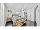 Bright main bedroom features neutral tones, modern furniture, and ample built-in storage at 1011 W Charter St, Tampa, FL 33602