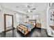 Bright main bedroom features neutral tones, modern furniture, and a large window at 1011 W Charter St, Tampa, FL 33602