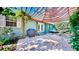 Outdoor patio area with pavers, covered pergola, grill and a hammock for relaxation at 1011 W Charter St, Tampa, FL 33602
