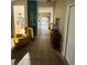 Inviting foyer featuring tile flooring, stylish furniture, and an open view into the living areas of the home at 11006 Laurel Brook Ct, Riverview, FL 33569