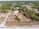 Aerial view of the property with boundaries, showing the home's layout and its surrounding landscape at 11054 Liberto Rd, Weeki Wachee, FL 34614